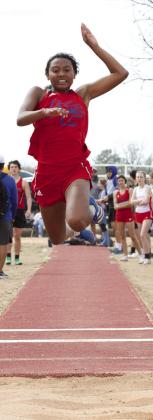 Naveah Martinez takes flight at the long jump. | SHERI BATY PHOTO
